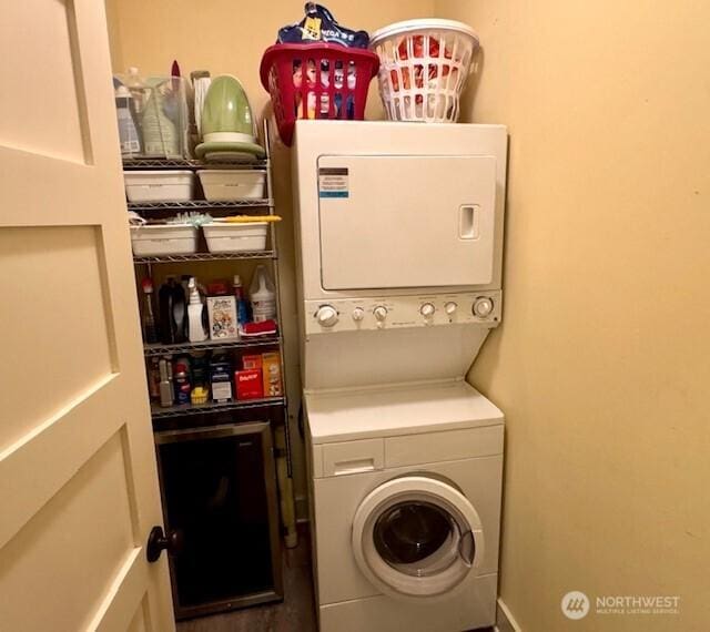 laundry area with laundry area and stacked washer and clothes dryer