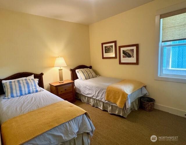 bedroom featuring carpet flooring and baseboards