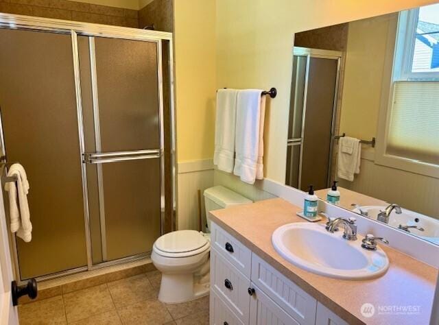 103 Shenanigan Ln, Oroville, WA 98844 - bathroom featuring a stall shower, tile patterned floors, vanity, and toilet