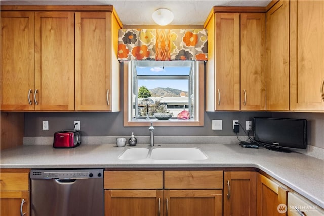 26 Pershing St, Wenatchee, WA 98801 - kitchen featuring dishwasher, light countertops, brown cabinetry, and built in desk