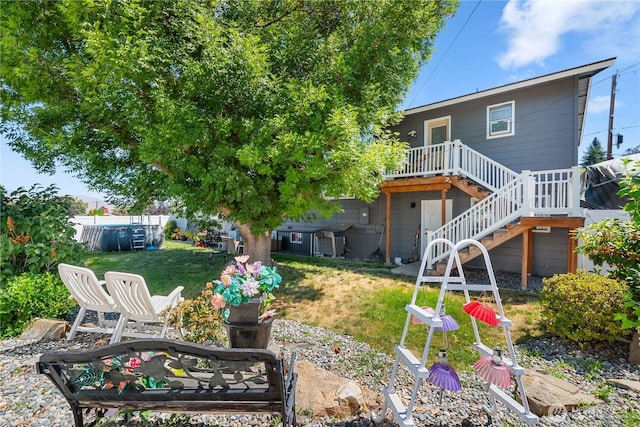 26 Pershing St, Wenatchee, WA 98801 - view of grassy yard featuring a deck and stairs