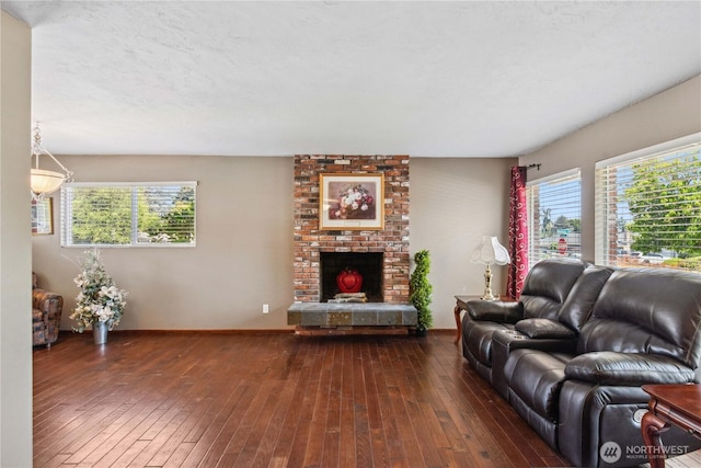 26 Pershing St, Wenatchee, WA 98801 - living room with dark wood finished floors, plenty of natural light, and a brick fireplace