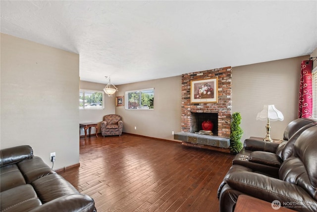26 Pershing St, Wenatchee, WA 98801 - living room with dark wood finished floors and a brick fireplace