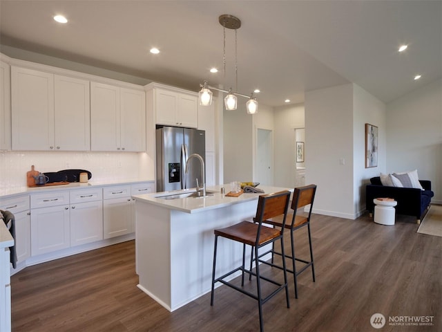 303 Kakela Rd, Winlock, WA 98596 - kitchen with stainless steel refrigerator with ice dispenser, dark wood-type flooring, light countertops, white cabinetry, and recessed lighting