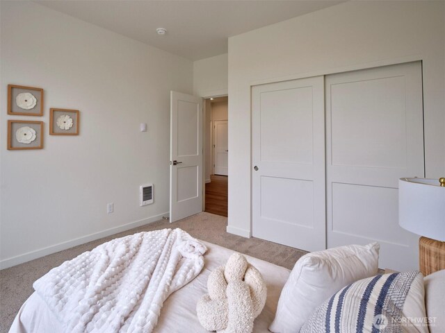 303 Kakela Rd, Winlock, WA 98596 - bedroom with light carpet, baseboards, and a closet