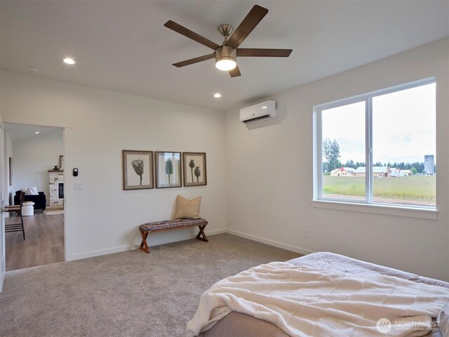 303 Kakela Rd, Winlock, WA 98596 - bedroom with a wall mounted air conditioner, multiple windows, carpet flooring, baseboards, and recessed lighting