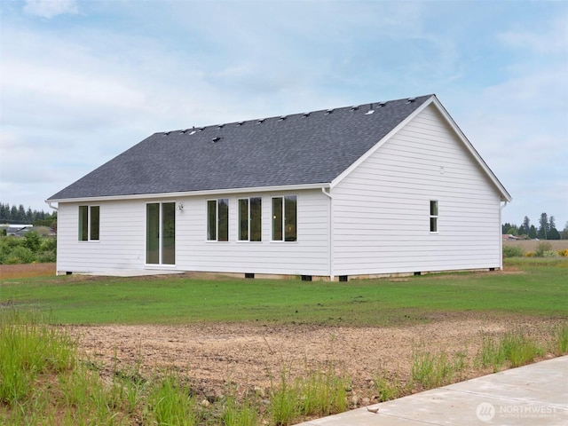 303 Kakela Rd, Winlock, WA 98596 - rear view of property featuring roof with shingles, crawl space, and a yard