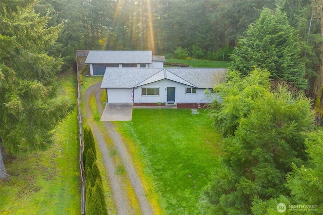 birds eye view of property with a forest view