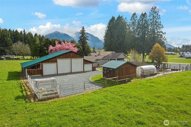 7095 N Wilde Rd, Concrete, WA 98237 - view of community with an outbuilding, a mountain view, and a garage