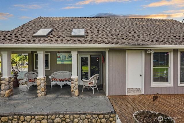 7095 N Wilde Rd, Concrete, WA 98237 - back of property with a shingled roof and a patio area