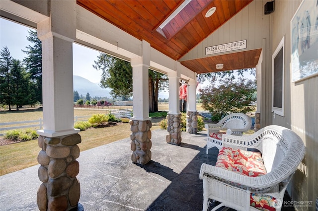 7095 N Wilde Rd, Concrete, WA 98237 - view of patio / terrace with covered porch, a mountain view, and fence