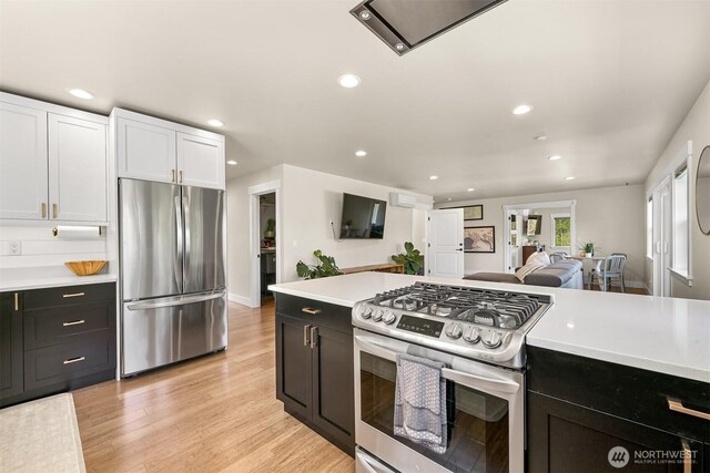 1699 Skagit St, Bellingham, WA 98226 - kitchen with appliances with stainless steel finishes, light countertops, dark cabinets, and recessed lighting