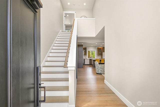 1699 Skagit St, Bellingham, WA 98226 - foyer featuring baseboards, recessed lighting, wood finished floors, and stairs