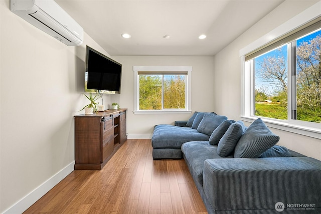 1699 Skagit St, Bellingham, WA 98226 - living room with baseboards, recessed lighting, light wood-style floors, and a wall mounted air conditioner