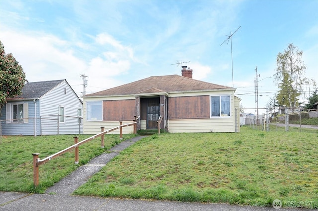 1257 S Ridgewood Ave, Tacoma, WA 98405 - bungalow-style house featuring a chimney, a front yard, and fence