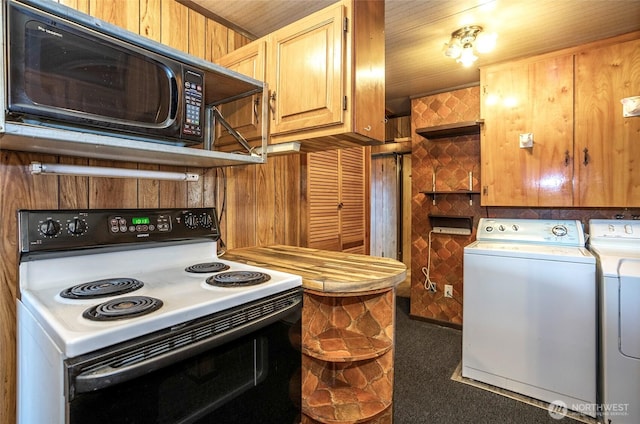 1257 S Ridgewood Ave, Tacoma, WA 98405 - kitchen with washer and clothes dryer, electric stove, and black microwave