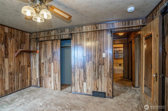 1257 S Ridgewood Ave, Tacoma, WA 98405 - unfurnished bedroom featuring wooden walls, visible vents, and carpet
