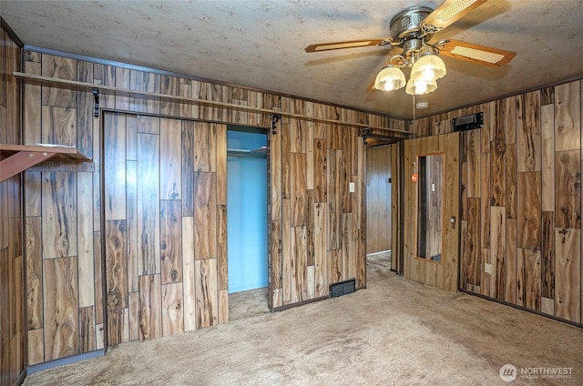 1257 S Ridgewood Ave, Tacoma, WA 98405 - unfurnished room with wooden walls, a ceiling fan, and carpet floors