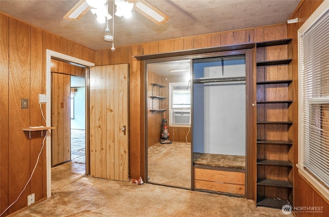1257 S Ridgewood Ave, Tacoma, WA 98405 - unfurnished bedroom featuring wooden walls, a closet, cooling unit, and carpet floors