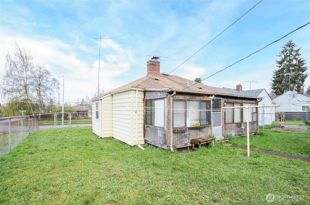 1257 S Ridgewood Ave, Tacoma, WA 98405 - back of property with fence and a lawn