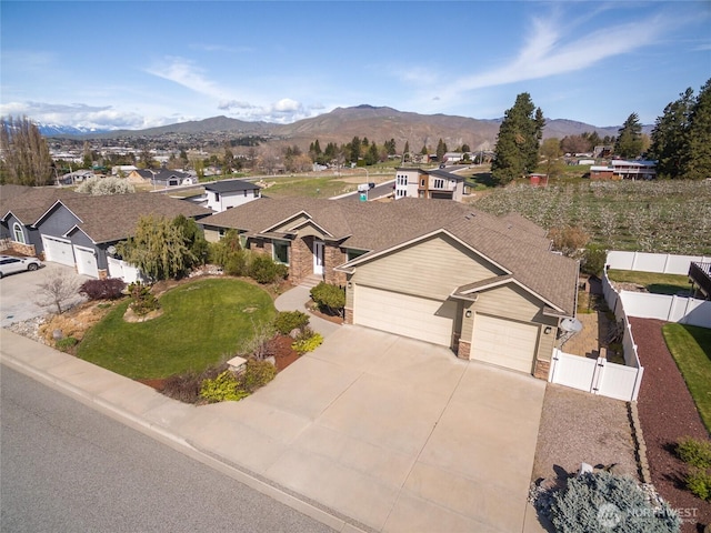 107 Springhill Dr, East Wenatchee, WA 98802 - ranch-style home featuring fence, a gate, an attached garage, a mountain view, and a residential view