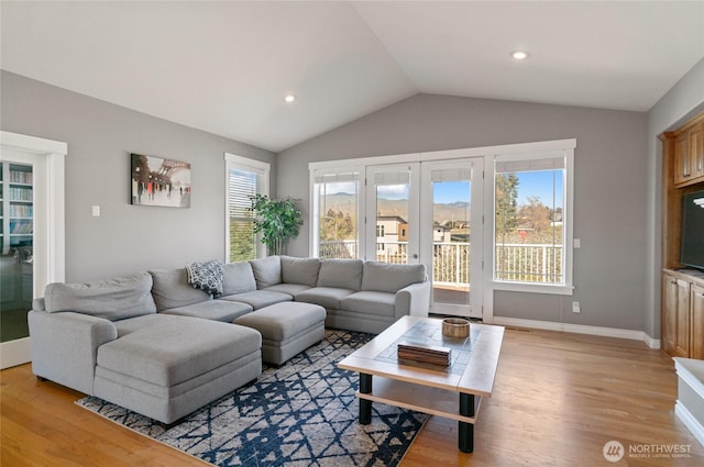 107 Springhill Dr, East Wenatchee, WA 98802 - living area with light wood-type flooring, vaulted ceiling, recessed lighting, french doors, and baseboards