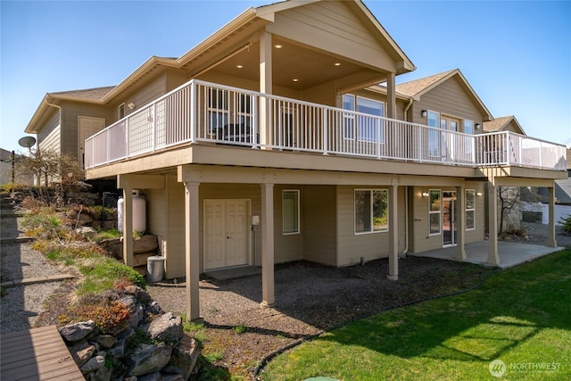 107 Springhill Dr, East Wenatchee, WA 98802 - rear view of house featuring a yard, a wooden deck, and a patio