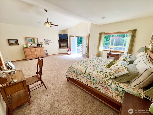 bedroom featuring ceiling fan, carpet floors, vaulted ceiling, and baseboards