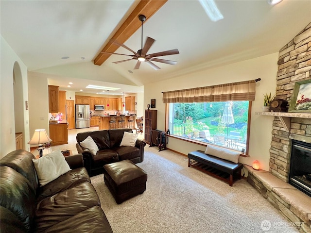 living room with lofted ceiling with beams, light carpet, recessed lighting, ceiling fan, and a fireplace