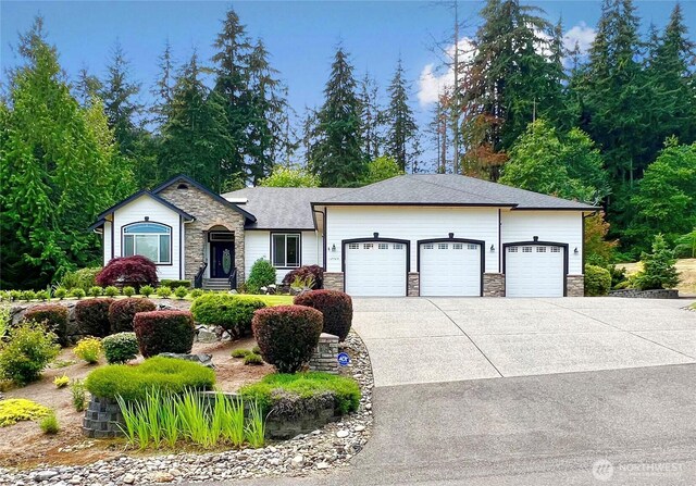 single story home featuring roof with shingles, driveway, stone siding, and a garage