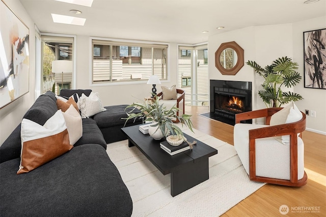 510 Lakeside Ave S Unit 10, Seattle, WA 98144 - living room featuring recessed lighting, a fireplace with flush hearth, a skylight, and wood finished floors