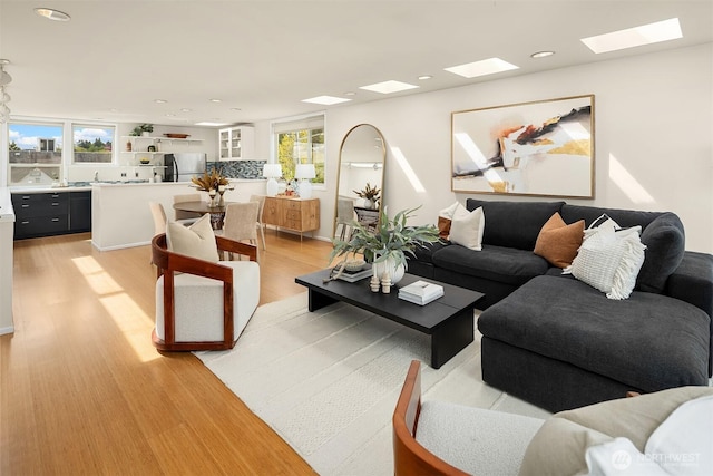 510 Lakeside Ave S Unit 10, Seattle, WA 98144 - living area with a skylight, light wood finished floors, and recessed lighting