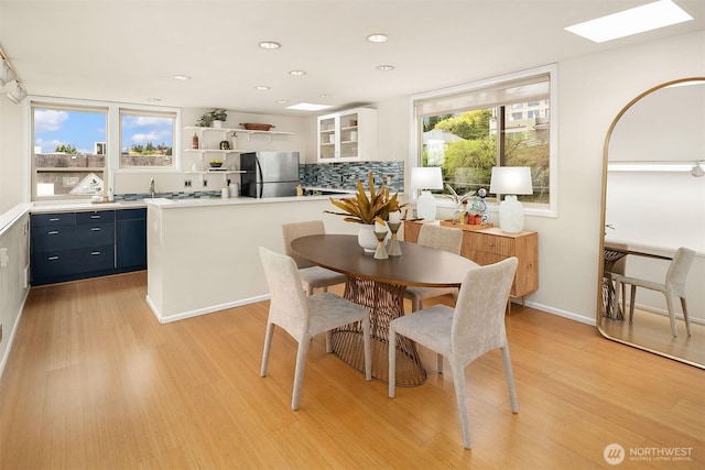 510 Lakeside Ave S Unit 10, Seattle, WA 98144 - dining space with a skylight, light wood-type flooring, and recessed lighting