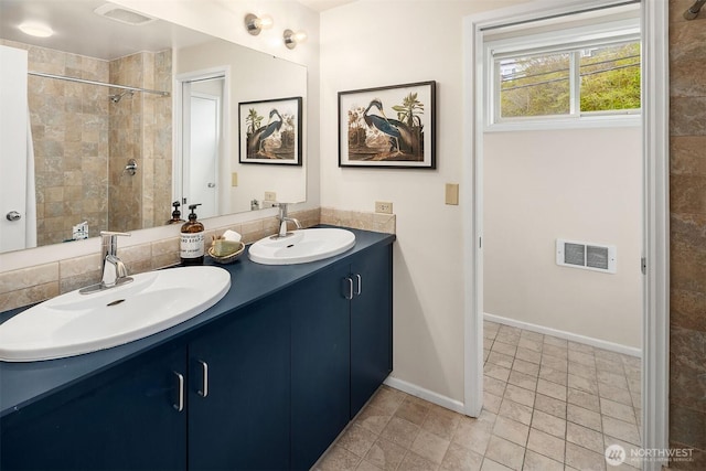 510 Lakeside Ave S Unit 10, Seattle, WA 98144 - full bath featuring a sink, visible vents, baseboards, and double vanity