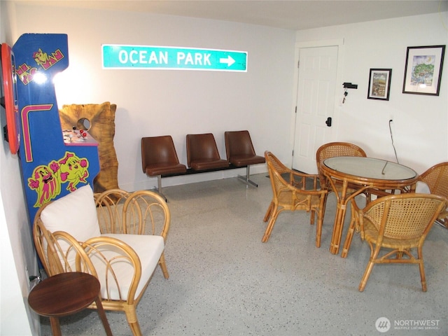 dining space with speckled floor