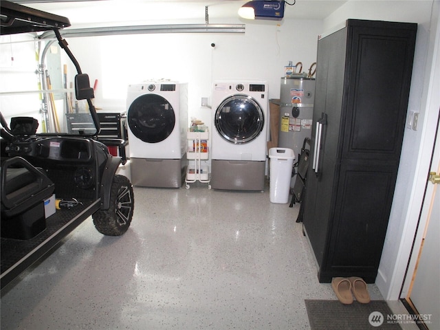 garage featuring washer and dryer and water heater