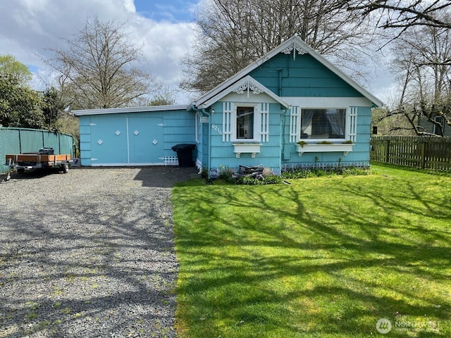 4216 N Pl, Seaview, WA 98644 - view of front of home with a front yard, fence, and driveway