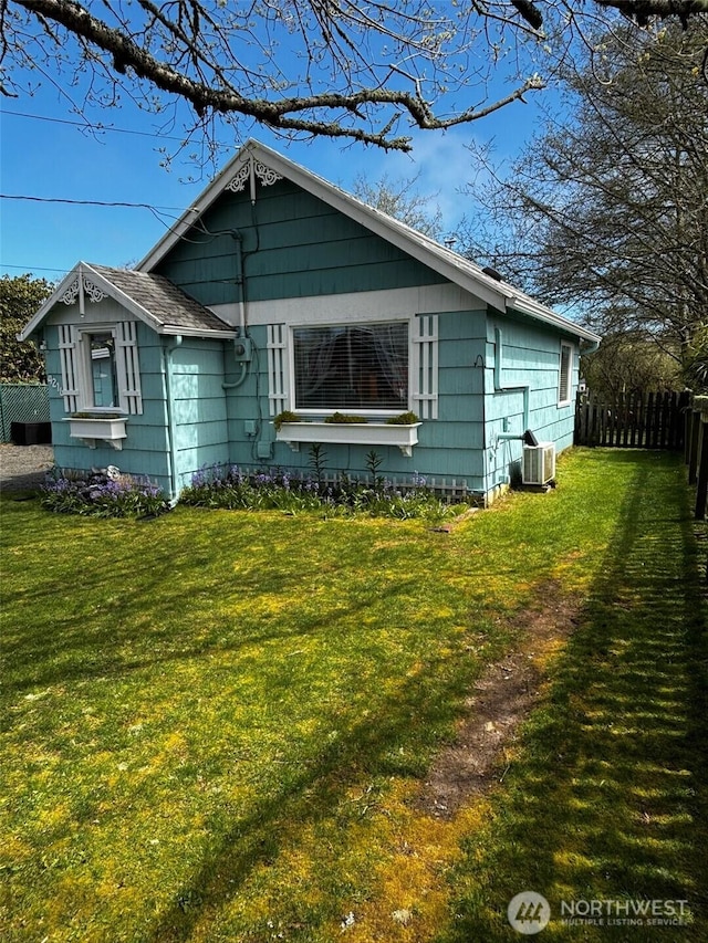4216 N Pl, Seaview, WA 98644 - view of front of house with fence, a front lawn, and cooling unit