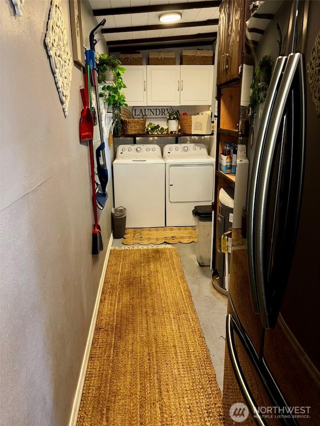 4216 N Pl, Seaview, WA 98644 - washroom featuring cabinet space, baseboards, and separate washer and dryer