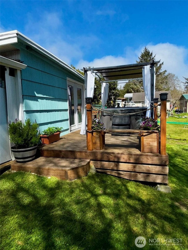 4216 N Pl, Seaview, WA 98644 - deck featuring french doors, a hot tub, and a yard