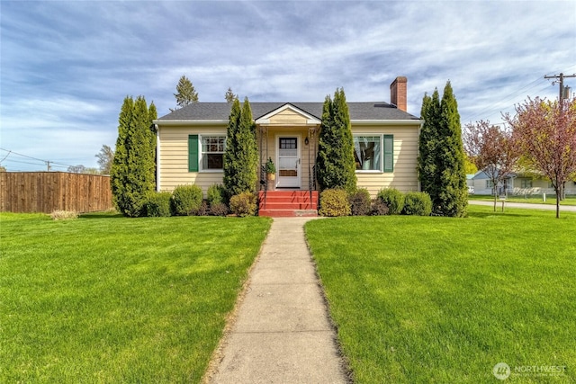 721 Main St, Waitsburg, WA 99361 - bungalow featuring a chimney, a front lawn, and fence