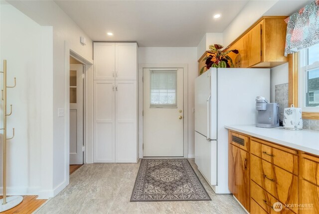 721 Main St, Waitsburg, WA 99361 - kitchen with backsplash, recessed lighting, light countertops, and freestanding refrigerator