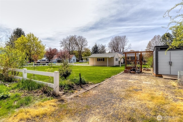 721 Main St, Waitsburg, WA 99361 - view of yard with an outdoor structure, fence, and a shed