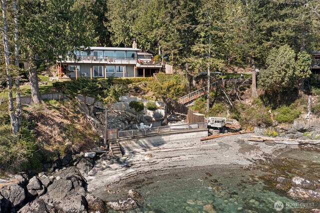 162 Sea Ranch Rd, Lopez Island, WA 98261 - back of property with a chimney and a view of trees