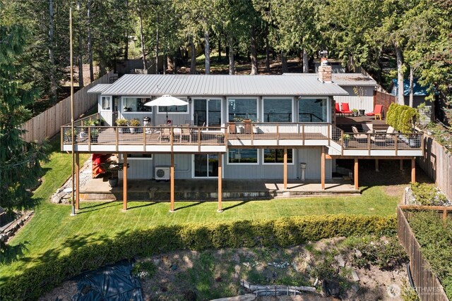 162 Sea Ranch Rd, Lopez Island, WA 98261 - back of property featuring a deck, a fenced backyard, and a lawn