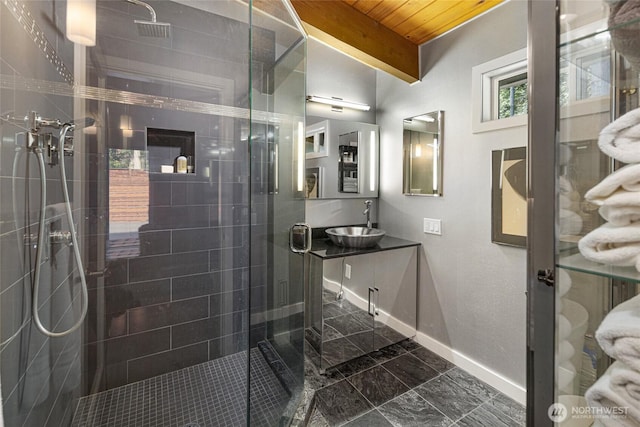 162 Sea Ranch Rd, Lopez Island, WA 98261 - bathroom with a stall shower, wooden ceiling, baseboards, vanity, and marble finish floor