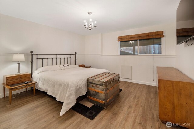 162 Sea Ranch Rd, Lopez Island, WA 98261 - bedroom with a chandelier and wood finished floors