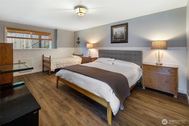162 Sea Ranch Rd, Lopez Island, WA 98261 - bedroom featuring wood finished floors and wainscoting
