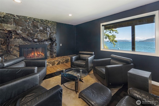 162 Sea Ranch Rd, Lopez Island, WA 98261 - interior space featuring recessed lighting, a stone fireplace, a water view, and baseboards