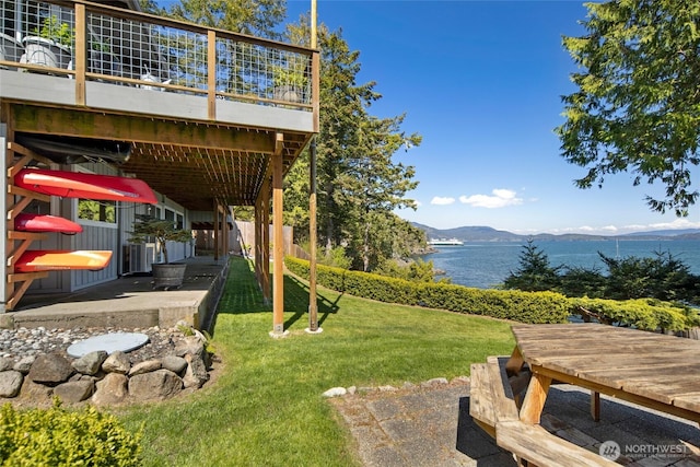 162 Sea Ranch Rd, Lopez Island, WA 98261 - view of yard featuring a deck with water view and a patio area